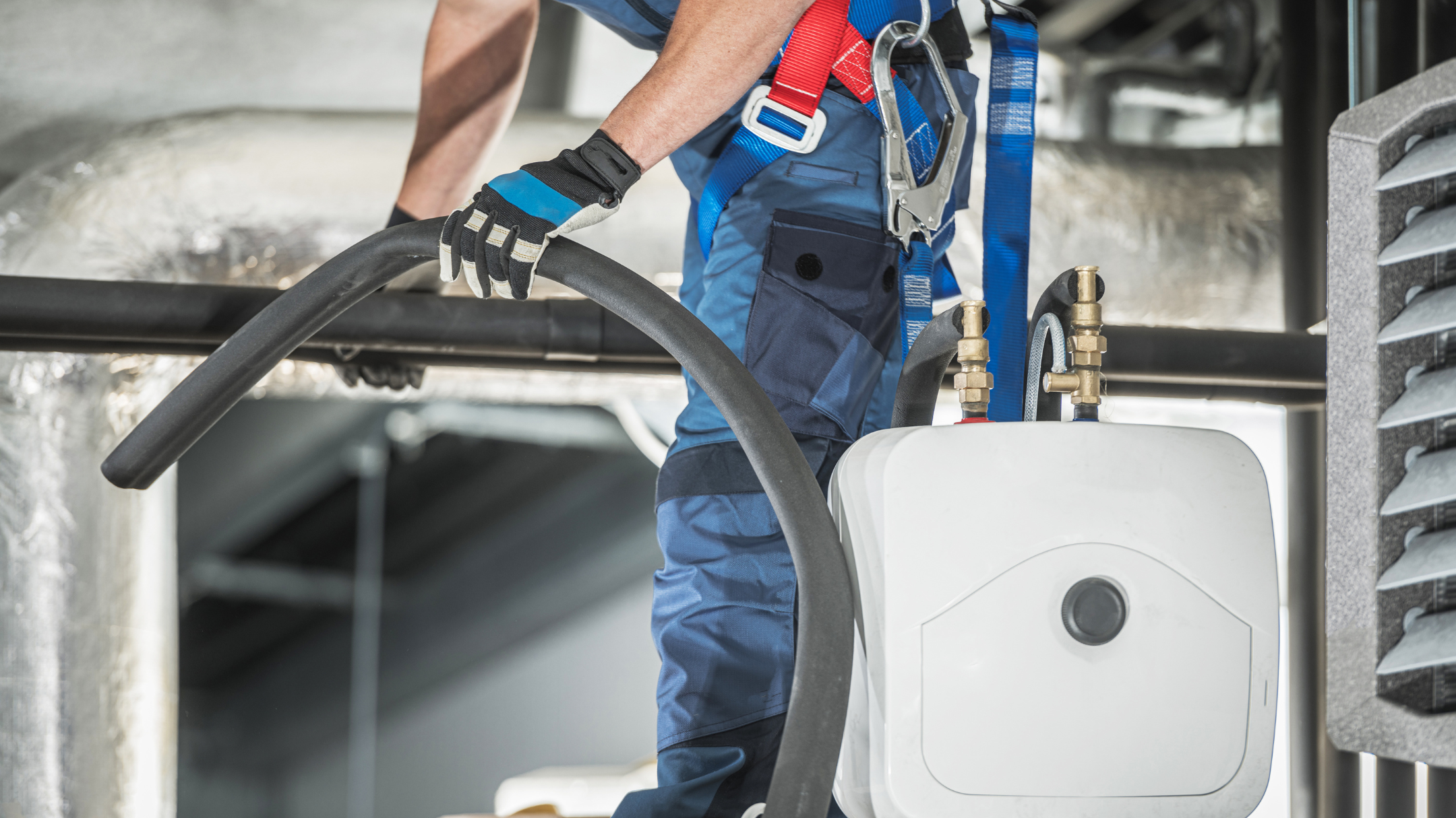 professional in blue uniform performing air conditioner installation service